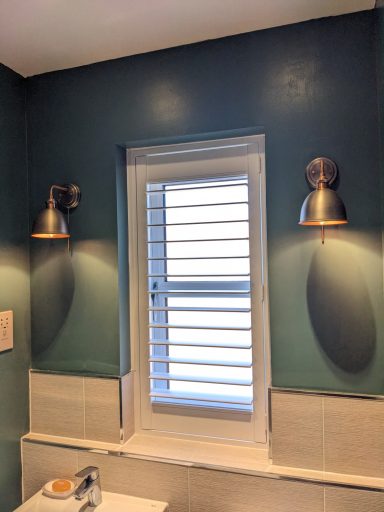 Modern living room with white window shutters