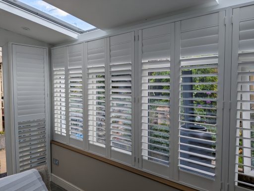 New conservatory with made to measure white window shutters