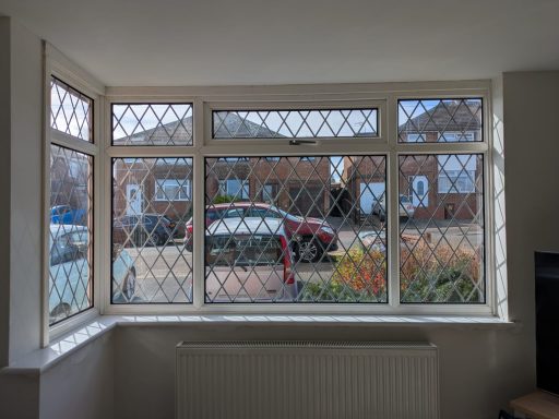 A two sided living room bay window before blinds