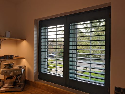 Modern living room with white window shutters